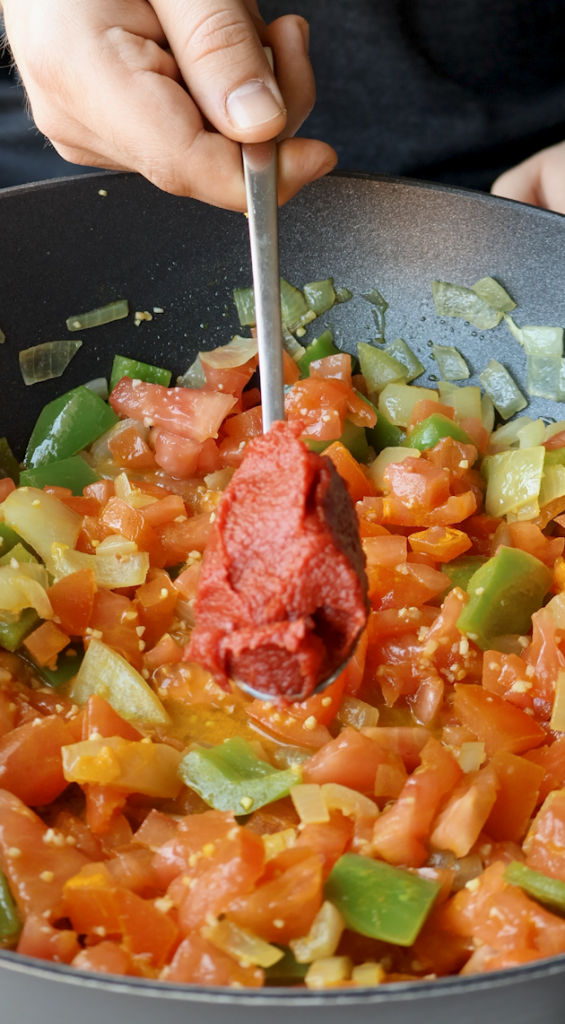 diced onions and green peppers, tomatoes, garlic, turmeric, salt, tomato paste,